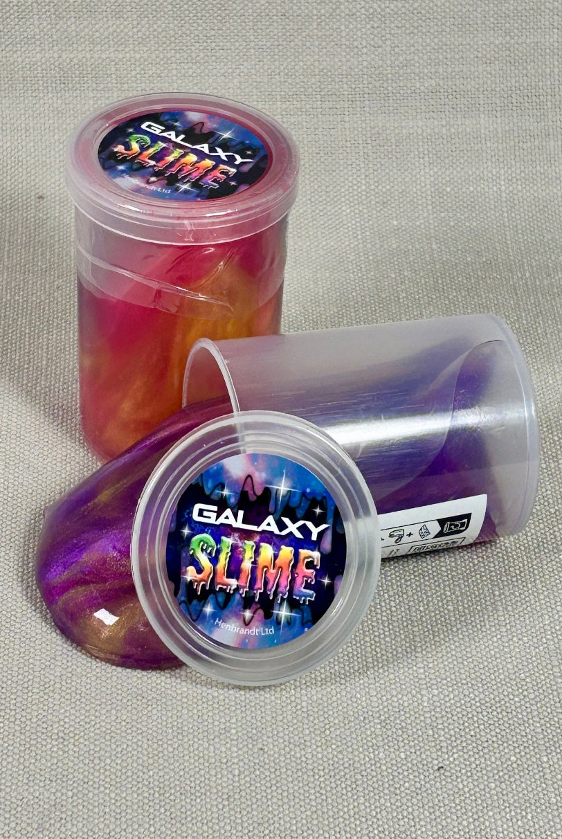 Two containers of Galaxy Slime on a textured gray background