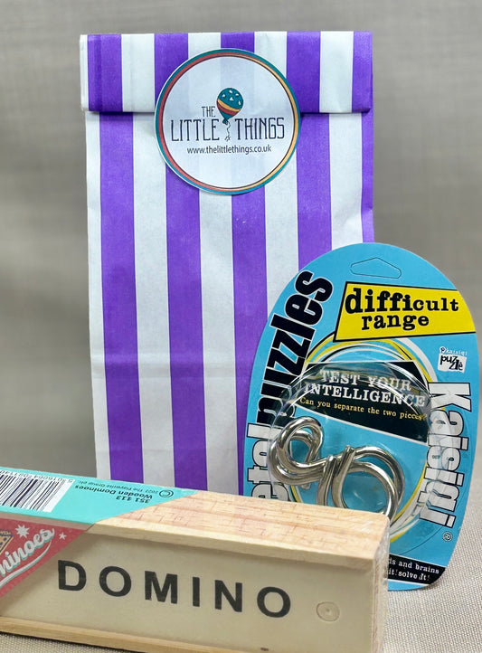 Collection of items including a striped party bag, a wire puzzle, and a set of wooden DOMINO.