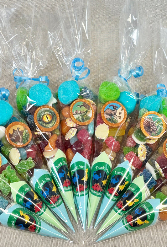 Cones filled with colorful candies on a gray background