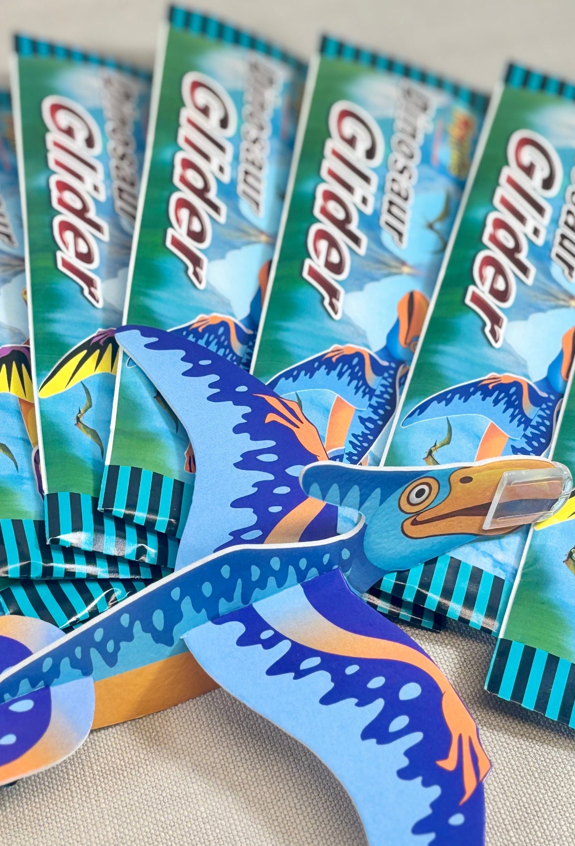Set of colorful dinosaur-shaped gliders.