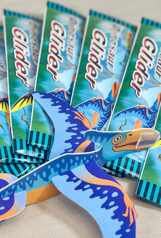Set of colorful dinosaur-shaped gliders.