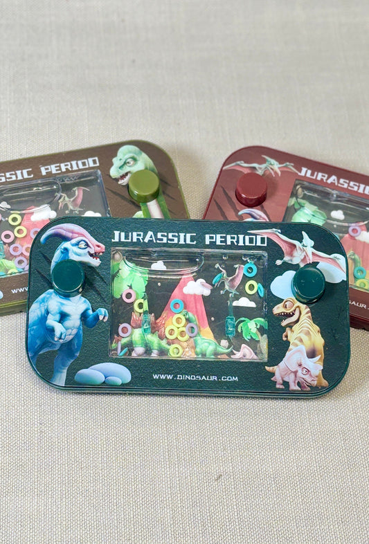 Jurassic Period water game toy packaging with dinosaur illustrations on a textured surface