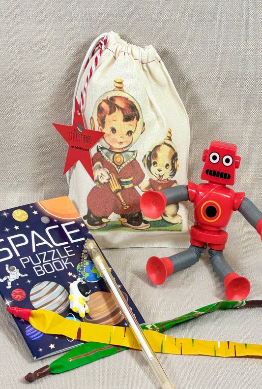Vintage style fabric drawstring party bag with fillers. Including flexi arm and leg robot, activity book, pen and rocket balloons. 