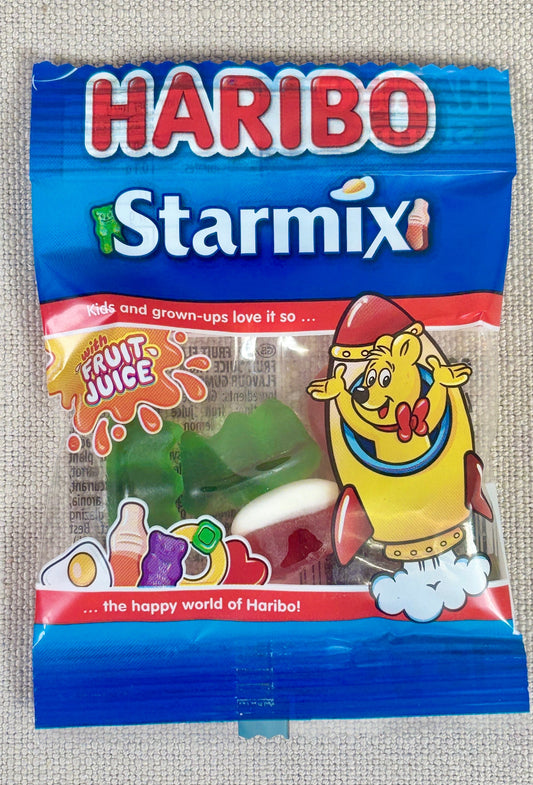 Haribo Starmix candy package on a textured gray background