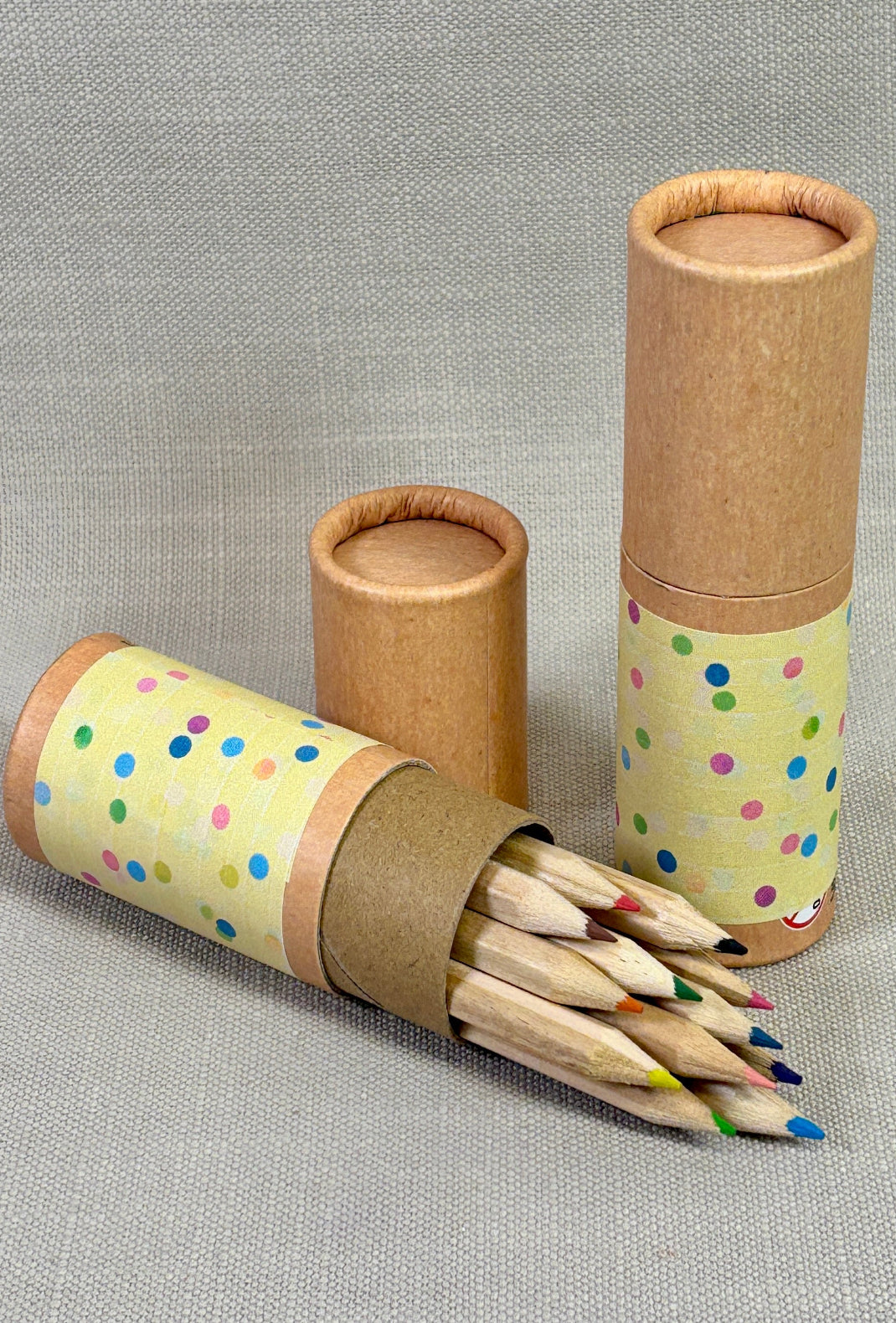 Tube of colouring pencils with spotty sticker.