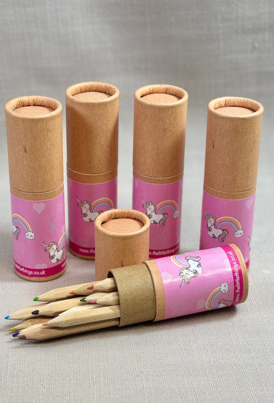 Set of colouring pencils in cardboard tubes with unicorn sticker.